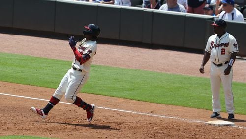 Braves outfielder Ronald Acuna pulls up at first base after just missing a home run against the Los Angeles Dodgers in the third inning Sunday at SunTrust Park.
