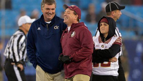 CHARLOTTE, NC - DECEMBER 06: Head coach Paul Johnson of the Georgia Tech Yellow Jackets and head coach Jimbo Fisher of the Florida State Seminoles share a laugh before the Atlantic Coast Conference championship game on December 6, 2014 at Bank of America Stadium in Greenville, North Carolina. (Photo by Grant Halverson/Getty Images)
