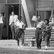 Willie Jean Black, Arthur Simmons and Donita Gaines leave Northside High School on the second day of class in 1961. The three were among nine Black Atlanta teens who integrated the Atlanta Public Schools that week in late August. Atlanta began integrating its schools seven years after the Supreme Court's Brown v Board decision. (Charles Pugh / AJC Archive at the GSU Library AJCP297-004b)