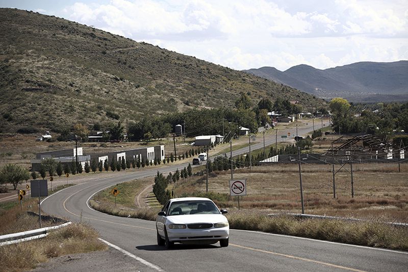 A car passes through Colonia LeBaron, one of many locations where the extended LeBaron family lives in the Galeana municipality of Chihuahua state in northern Mexico.