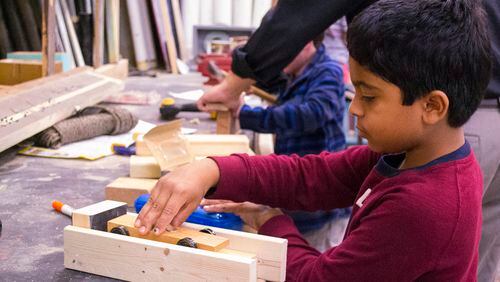 Rohan Dalvi, a fourth grader at The Galloway School in Buckhead, works on building a race car and track as part of the school’s “passion project,” a program that allots class time for students to work on projects that interest them.