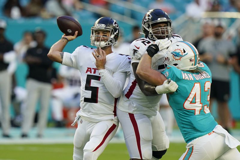 Atlanta Falcons quarterback AJ McCarron (5) looks to pass during the first half of a NFL football game against the Miami Dolphins, Sunday, Dec. 13, 2020, in Miami Gardens, Fla. (AP Photo/Lynne Sladky)