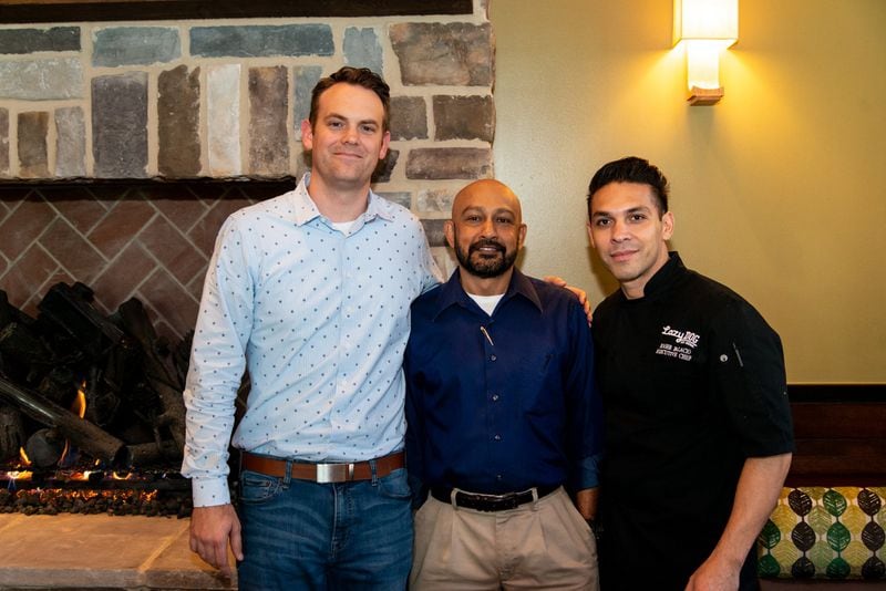Lazy Dog Restaurant and Bar team (from left to right) Regional Operations Director Mike Ogilvie, Operating Partner Nick Munaweera, and Executive Chef Roger Palacio. Photo credit- Mia Yakel.