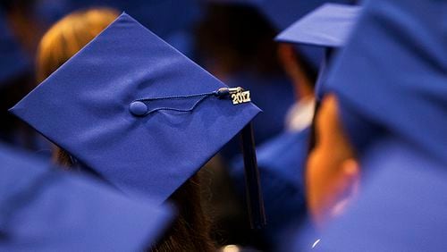A 2017 charm sits on top of a graduate's hat during McCallum High School's commencement ceremony at the Erwin Center in Austin on Thursday, June 1, 2017. NICK WAGNER/AMERICAN-STATESMAN
