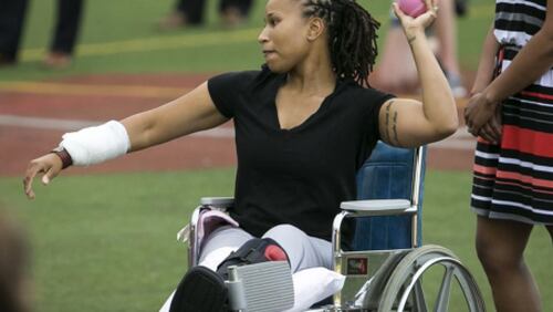 Injured police office Crystal Griner threw the first pitch at Wednesday’s Congressional Women’s Softball game in Washington, D.C. June 21, 2017. (Al Drago/The New York Times)
