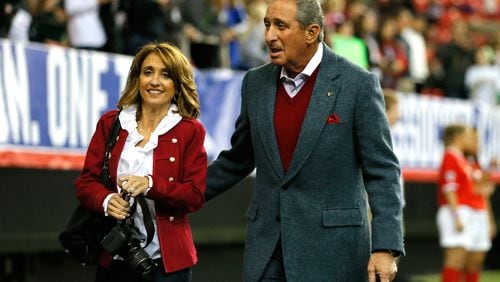 Owner Arthur Blank of the Atlanta Falcons and Angela Macuga walk the pitch prior to the match between the United States Women's National Team and the Russia National Team at Georgia Dome on February 13, 2014 in Atlanta, Georgia. (Photo by Kevin C. Cox/Getty Images)
