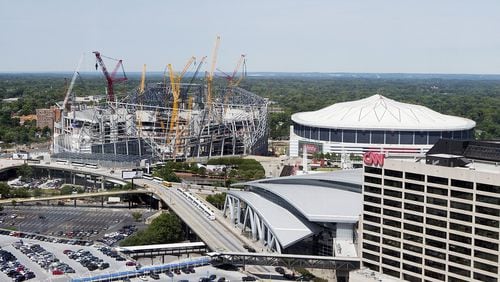 Mercedes-Benz Stadium, slated to open next year, is under construction next to the Georgia Dome. (AP File Photo/David Goldman)
