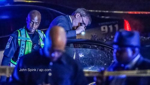 Police in DeKalb County, Georgia, investigate a fatal shooting on Flat Shoals Road on Thursday, Feb. 22, 2018.