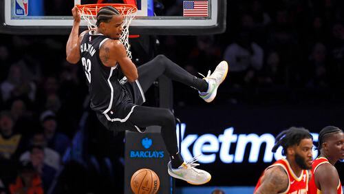 Brooklyn Nets center Nic Claxton (33) reacts after a dunk against the Atlanta Hawks during the second half of an NBA basketball game, Saturday, March 2, 2024, in New York. The Brooklyn Nets won 114-102. (AP Photo/Noah K. Murray)