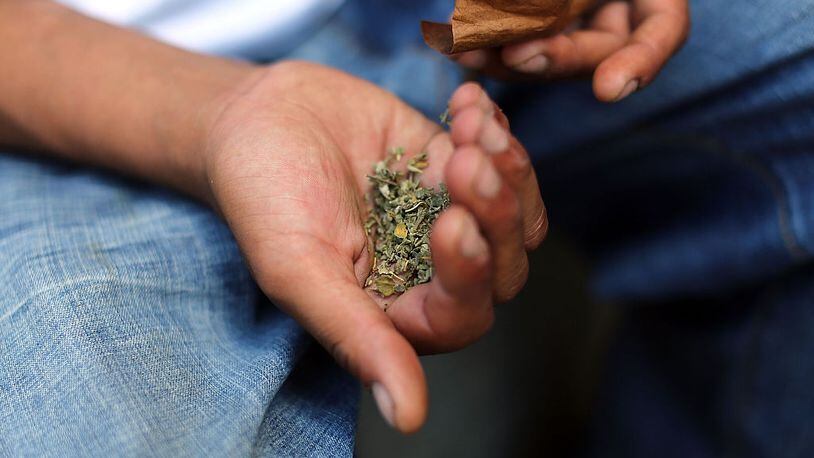 A man prepares to smoke K2 or "Spice", a synthetic marijuana drug. Cities around the country are experiencing a deadly epidemic of synthetic marijuana usage including varieties known as K2 or "Spice" which can cause extreme reactions in some users.