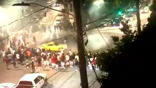Similar to Atlanta, Roswell Police said illegal street racing exhibitions are drawing crowds that block intersections and shutdown late night traffic. Pictured is an Atlanta street racing scene.