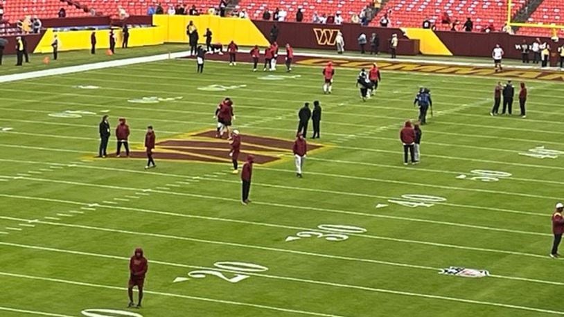 The Commanders and the Falcons warming up at FedEx Field on Sunday. (By D. Orlando Ledbetter/dledbetter@ajc.com)