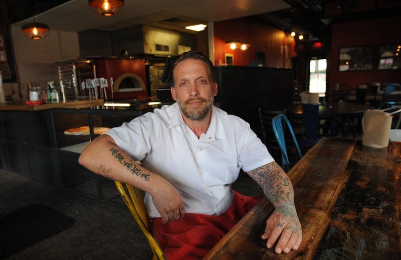 Chef/owner Anthony Spina in the dining room at O4W Pizza in Duluth. (BECKY STEIN PHOTOGRAPHY)