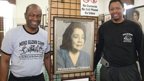 This painting of Coretta Scott King is on dispaly at Mike Glenn’s exhibit “Expanding Civil Rights: With a Focus on Women of the Movement” at the Decatur library. That’s Glenn on the left and Willie Brown, who played at Hofstra and Georgia State, and probably remains the only fully-deaf, full-scholarship athlete to play Division I basketball. Courtesy of Greg White