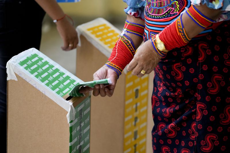 An Indigenous woman votes during a general election in Panama City, Sunday, May 5, 2024. (AP Photo/Matias Delacroix)