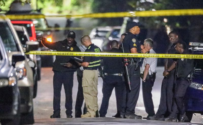 Officials were in northwest Atlanta early Thursday to investigate an officer-involved shooting that left a man with life-threatening injuries. JOHN SPINK / JSPINK@AJC.COM