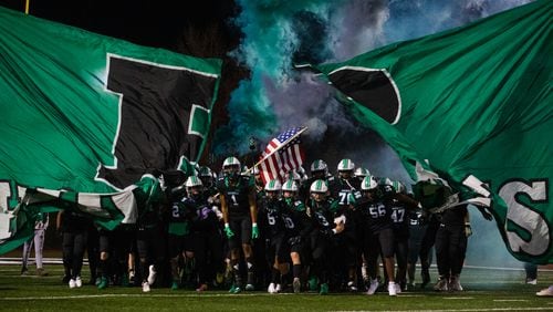 Roswell takes the field at the beginning of the Mill Creek vs. Roswell high school football game on Friday, November 27, 2020, at Roswell High School in Roswell, Georgia.