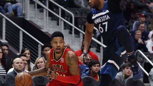 Taj Gibson defends Kent Bazemore during the Hawks' victory on Monday night.