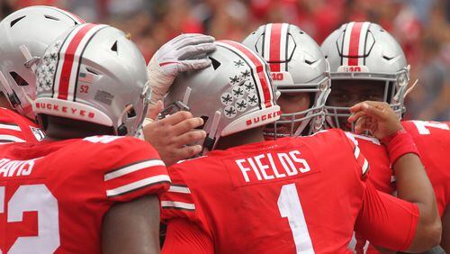 Justin Fields and the Buckeyes celebrate during the first half of their game against Cincinnati on Saturday, Sept. 7, 2019, in Columbus, Ohio.