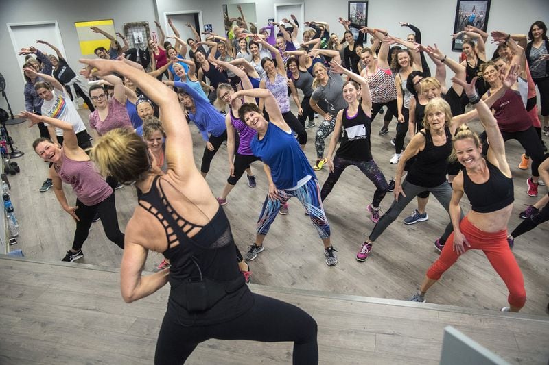 Experts recommend trying different forms of exercise and go with the one that is fun. In this 2018 file photo, Jazzercise president Shanna Missett Nelson, daughter of the CEO and founder, teaches a standing-room-only class at a newly opened center in Spokane, Wash. (Dan Pelle/The Spokesman-Review/TNS)