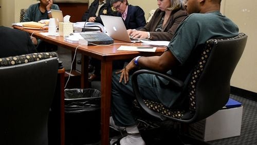Therian Wimbush, left, and Recardo Wimbush, right, appeared in court Thursday, March 19, 2015, in an attempt to regain custody of their 10 children.