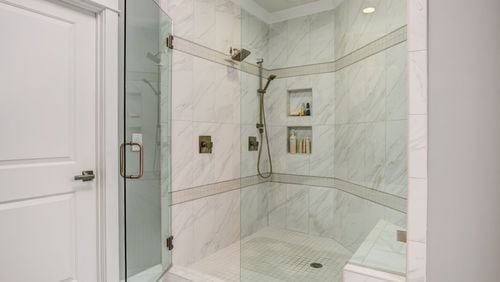 Spacious showers with niches and benches are replacing traditional bathtubs. Contributed by FrontDoor Communities