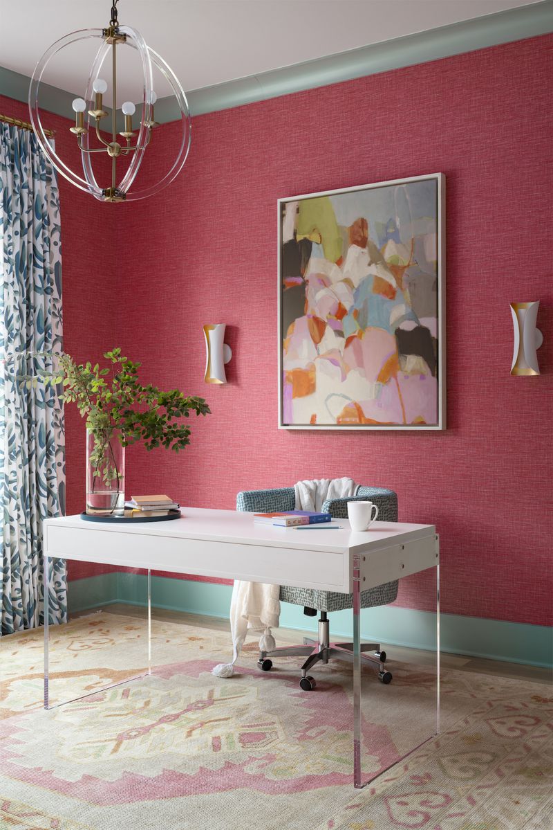 Many women are creating home offices that lean into bold, feminine color as in this hot pink space from interior designer Gina Sims.
(Courtesy of Cati Teague Photography for Gina Sims Designs)