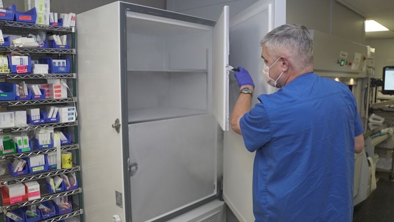 Marl Halbrook, operations manager at the pharmacy at Phoebe Putney Health System's main hospital campus in Albany, with one of the ultra-cold freezers purchased for the Pfizer vaccine. (Photo courtesy of Phoebe Putney Health System)
               