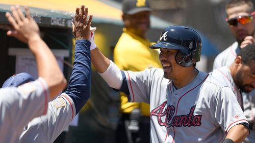 Braves catcher Kurt Suzuki celebrates his solo home run Sunday in Oakland, giving the Braves an early lead. (Thearon W. Henderson/Getty Images)