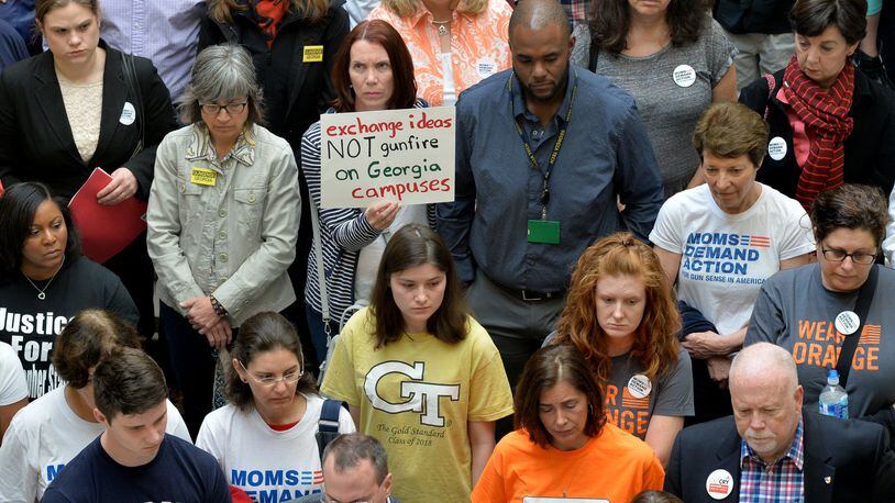 Groups opposed to campus-carry rally in the Capitol in March 2016 before delivering 30,000 petitions to Gov. Nathan Deal’s office urging the veto of the bill that eventually became law in Georgia. BRANT SANDERLIN/BSANDERLIN@AJC.COM