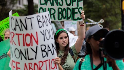 Abortion rights activists protest July 21 in Atlanta. The previous day a federal appeals court allowed Georgia’s restrictive “heartbeat” abortion law to take effect. (Arvin Temkar / arvin.temkar@ajc.com)