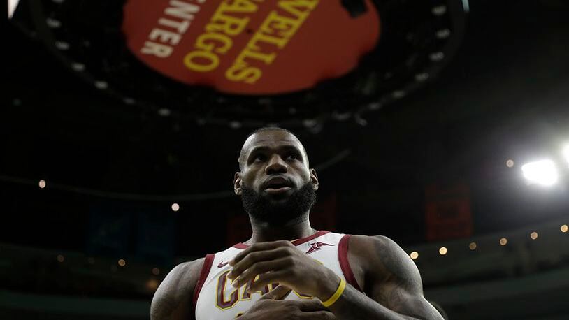 FILE - In this Nov. 27, 2017, file photo, Cleveland Cavaliers' LeBron James is shown during an NBA basketball game against the Philadelphia 76ers, at the Wells Fargo Center in Philadelphia. This LeBron James-to-Philly stuff is getting either silly â or serious.Â Just days after three billboards, paid for by a Pennsylvania company, popped up in Ohio urging James to sign with the 76ers this summer as a free agent, the three-time NBA champion reportedly was spotted in the Philadelphia area over the All-Star break touring area high schools. (AP Photo/Matt Slocum, File)