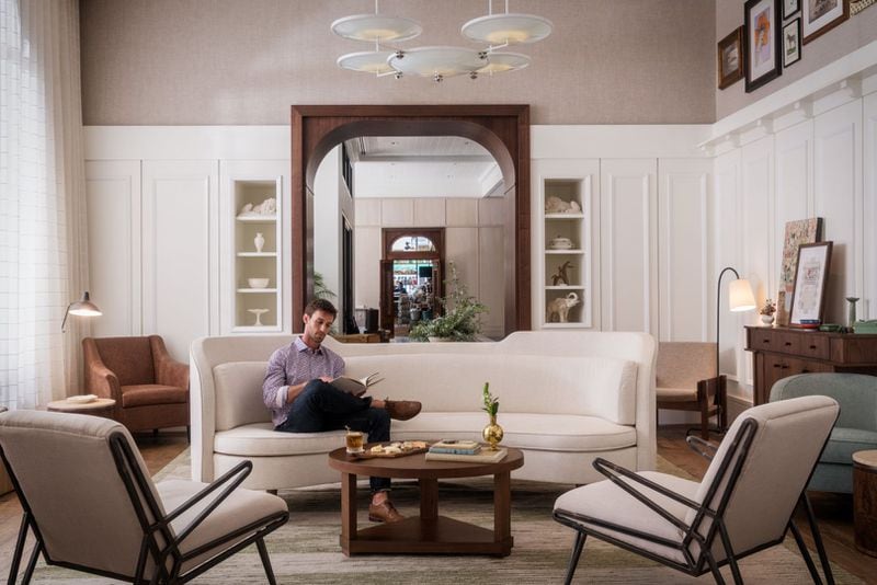 A guest relaxes in a lounge off the lobby at the Perry Lane Hotel in Savannah's historic district. The property, which opened in 2018, redefined luxury accommodations in the city. (Photo courtesy of Perry Lane Hotel)