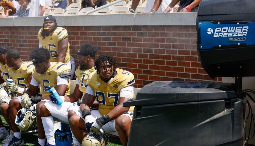 Team Swarm members, including Akelo Stone (97), keep cool during Georgia Tech's spring football game in Atlanta on Saturday, April 15, 2023.   (Bob Andres for the Atlanta Journal Constitution)