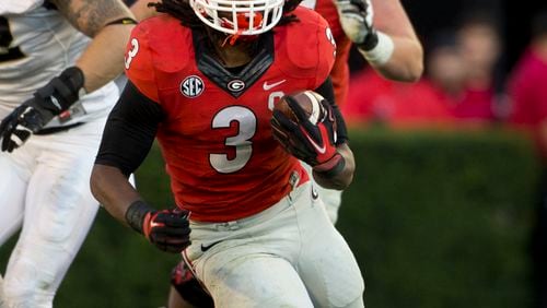 Georgia running back Todd Gurley (3) breaks through the Vanderbilt line in the second half of an NCAA college football game Saturday, Oct. 4, 2014, in Athens, Ga.. Georgia won 44-17. (AP Photo/John Bazemore) Todd Gurley has been one of the nation's top Heisman candidates all season. (AP photo)