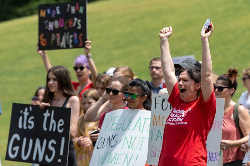 People cheer on the speakers at a rally organized by Georgia Moms Demand Action in Piedmont Park Saturday, May 13, 2023. The rally was part of a national series of protests the day before Mother’s Day to highlight the mounting toll of gun violence. (Steve Schaefer/steve.schaefer@ajc.com)