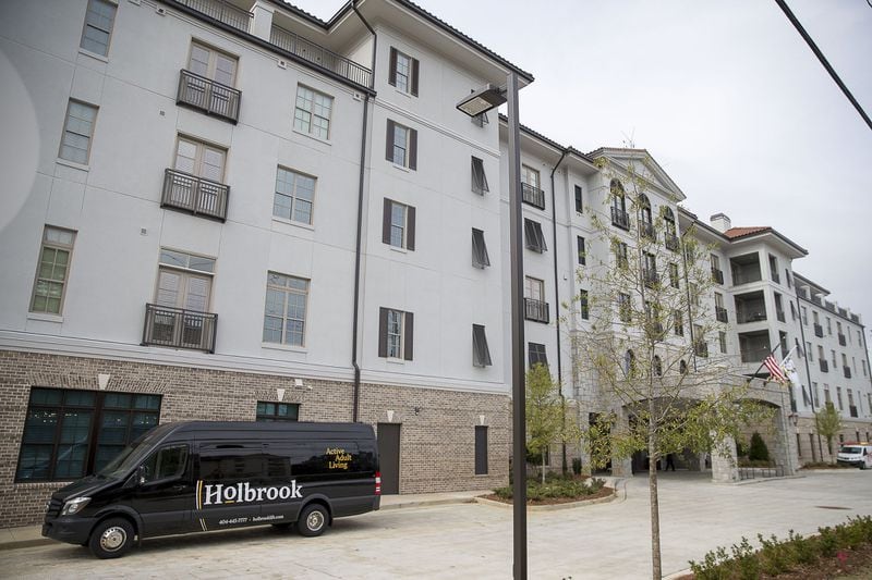 A shuttle sits outside the Holbrook of Decatur, an upscale senior living community. The complex offers residents free transportation to nearby locations. (Alyssa Pointer/Atlanta Journal Constitution)