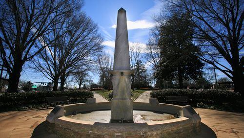 A fountain shown in the center of the Roswell Town Square honors Roswell's founding families. The Town Square was created to be a green space for recreation in Roswell King's original design for the city. (AJC file photo / Jason Getz 2015)