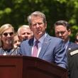 Georgia Gov. Brian Kemp has signed into law a bill cracking down on property squatters. (Natrice Miller/Atlanta Journal-Constitution via AP)