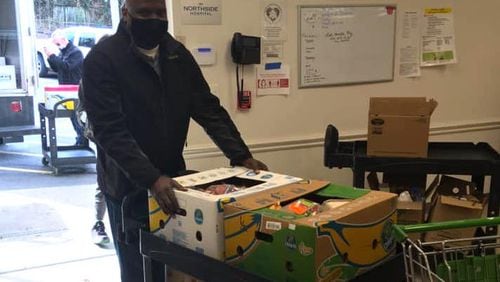 Community Assistance Center volunteer, Martin Willis, helps support the food pantry. (Courtesy Community Assistance Center)