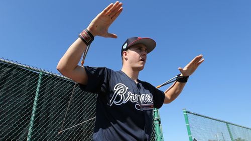 Braves pitcher Tucker Davidson loosens up his arms before pitching in the bullpen Sunday, Feb. 17, 2019, at the ESPN Wide World of Sports Complex in Lake Buena Vista, Fla.