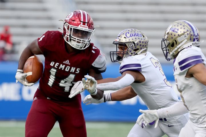 Warner Robins tight end Deondre King (14) runs after a catch against Cartersville defensive back Evan Slocum (3) in the first half of the Class 5A state high school football final at Center Parc Stadium Wednesday, December 30, 2020 in Atlanta. JASON GETZ FOR THE ATLANTA JOURNAL-CONSTITUTION