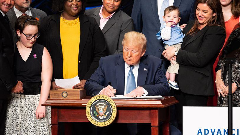 President Donald Trump signs an executive order Wednesday to advance kidney health at the Ronald Reagan Building and International Trade Center in Washington. (PHOTO by Michael Brochstein/Sipa USA/TNS)