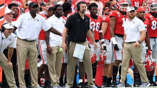 Georgia defensive coordinator Dan Lanning (black shirt) is back to oversee the Bulldogs' defensive pursuits for a third season after turning down lucrative offers to leave for Florida State and Texas the past two years. (Perry McIntyre/UGA)