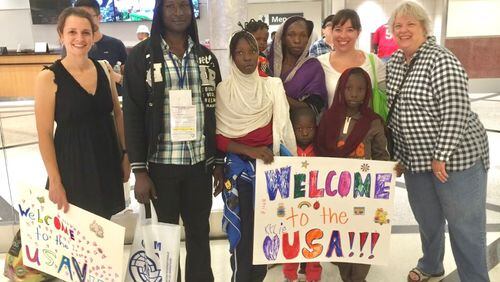 New Hope Baptist Church members Tina Ortkiese, Rebecca Bankey and Diana Evans welcomed a refugee family from Central African Republic as they arrived in Atlanta en route to resettlement in Clarkston. Photo courtesy of Rebecca Bankey