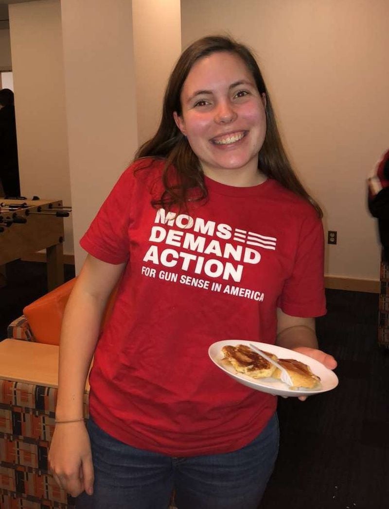 Madeleine Deisen, 18, wears a T-shirt calling for gun-law reform during a pancake breakfast at her George Washington University dorm. Deisen helped organized a 2018 student walkout at Cobb County’s Walton High School and said she continues to use the political skills she picked up to campaign for causes and candidates as a first-year college student in Washington.