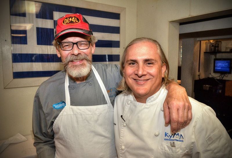 After sharing a few old kitchen war stories, Chef Tenney Flynn (left) poses with old friend and former co-worker Pano I. Karatassos in the kitchen of Kyma in Buckhead, where Karatassos is executive chef. Flynn, who lives in New Orleans, but who was born and raised in Stone Mountain, Georgia, got his start with the Buckhead Life Restaurant Group. He has a new book out on fish and seafood, which is where the recipes come from. All photos taken Friday July 26, 2019 at Kyma in Buckhead. Food styling by Tenney Flynn. (Chris Hunt Photography)