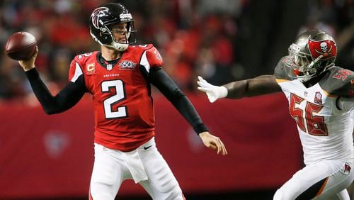 Atlanta Falcons quarterback Matt Ryan (2) works as Tampa Bay Buccaneers defensive end Jacquies Smith (56) gives chase during the second of an NFL football game, Sunday, Nov. 1, 2015, in Atlanta. (AP Photo/John Bazemore) 