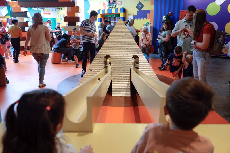 Children play in the Build Adventures area of the newly remodeled Lego Discovery Center Atlanta at Phipps Plaza on Friday, March 31, 2023. After six months of renovations, the attraction opened with upgrades and new additions. (Natrice Miller/natrice.miller@ajc.com)