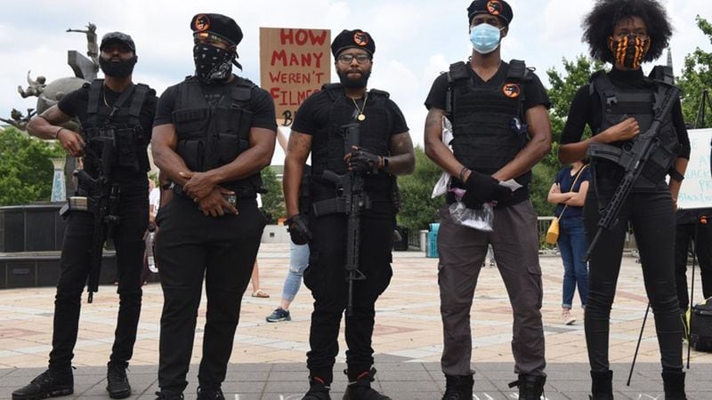 The NOT “New Black Panthers” toting their firepower at a recent protest in Decatur. Photo by RYON HORNE / AJC